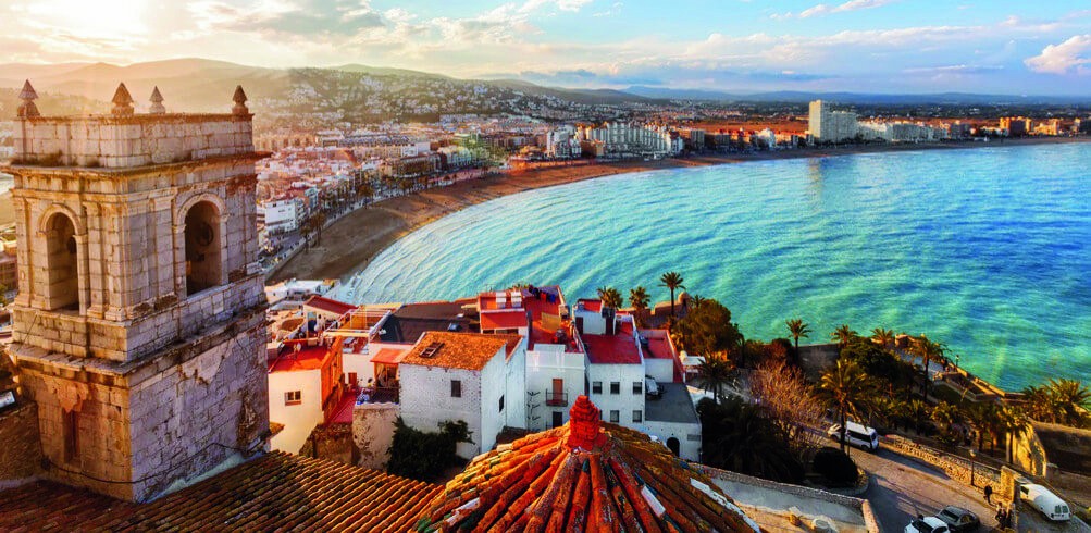 Mediterranean coastal bay with historic stone tower
